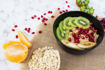 Healthy breakfast. Oatmeal with fruit on white background