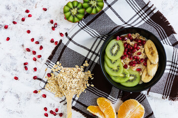 Healthy breakfast. Oatmeal with fruit on white background. Top view