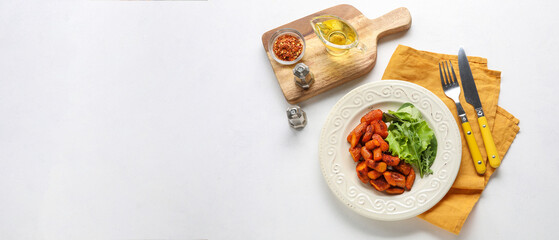 Fototapeta na wymiar Plate with tasty baked carrot with herbs, oil and spices on white background with space for text