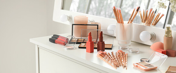 Set of decorative cosmetics on table of makeup artist in salon