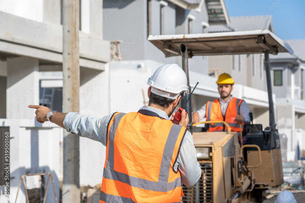 Aufkleber construction worker are checking the construction progress of the housing project,engineer,construct