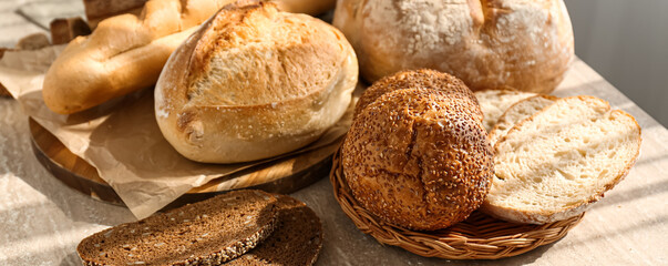 Assortment of fresh bread on light table