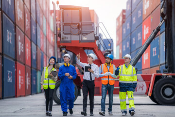 Businessman and Technicians or engineer working at Container yard warehouse,Cargo Shipping Import and Export industry.