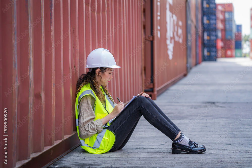 Poster Container yard worker sitting at container box and rest.
