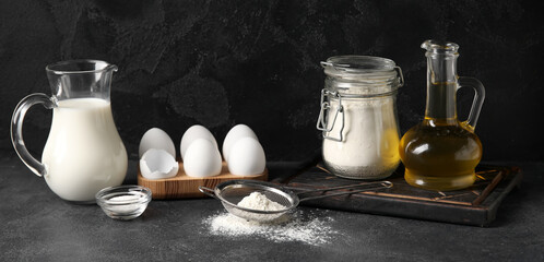 Ingredients for baking on dark background