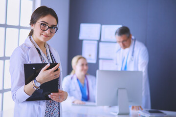 Woman doctor standing with stethoscope at hospital