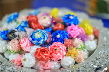 Blurred abstract background of hands digging in water in a religious ceremony, dedicated to the deceased.