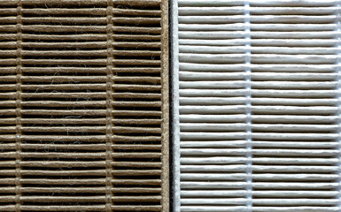 Close-up Old and new air purifier filter in comparison: dusty, dirty filter after use and clean.