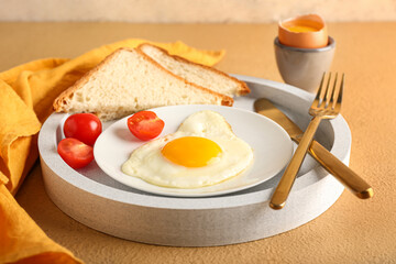 Tray with tasty breakfast on color table, closeup