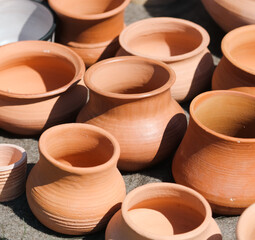 Clay jars at the market for food.