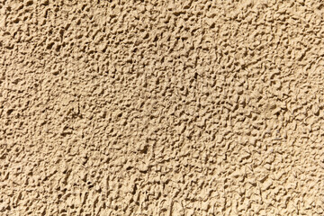 Decorative plaster on the wall of the house as an abstract background.