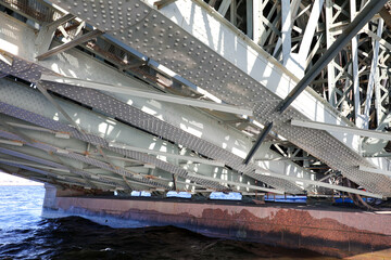 Large metal bridge on the river.