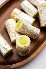 Kaju Pista Roll Or Cashew Pistachio Rolls Mithai or sigar, Indian sweet or dessert for festivals