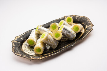 Kaju Pista Roll Or Cashew Pistachio Rolls Mithai or sigar, Indian sweet or dessert for festivals