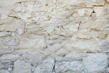 Ancient brick wall in Provence, France. Good for background, banner etc. Stones are irregular, different size and with different light grey tones. .