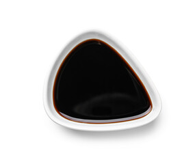 Bowl of soy sauce on white background