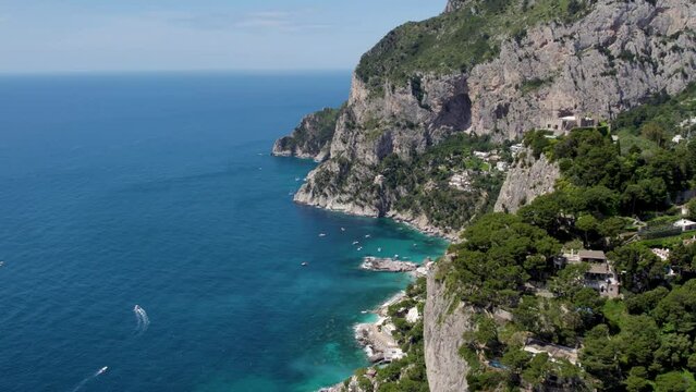 Dramatic Cliffs Overlooking Picturesque Coastline of Exotic Capri, Italy - Aerial