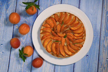 Recipe for apricot tart, sandy paste, almond cream, verbena decoration. High quality photo