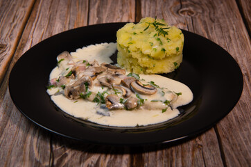 Recipe for fillet of sea bream in white wine sauce with mashed potatoes and mushrooms. High quality photo
