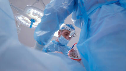Doctor doing surgery in modern operating room