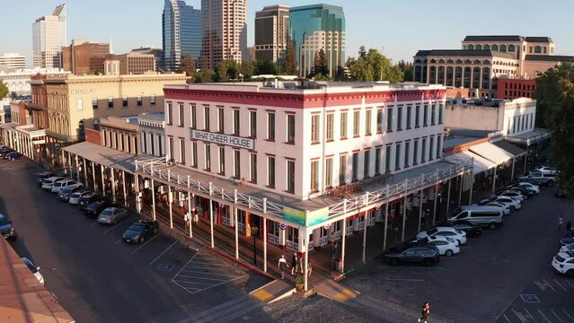 Reverse pullback aerial shot of the What Cheer House in Old Town Sacramento. 4K
