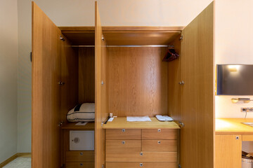 Wooden closet in hotel room