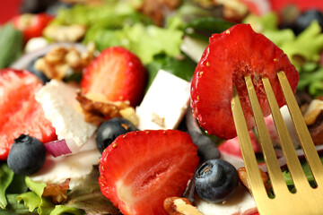 Concept of tasty salad, salad with strawberry, close up