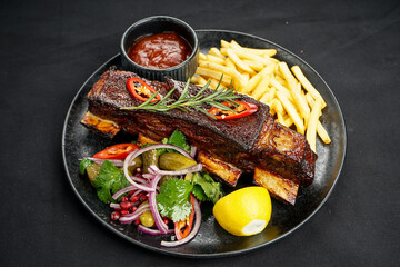 rib stew in a plate with French fries
