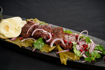 fried kebab on a wooden board

