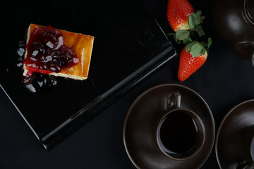 dessert cake cheesecake on a black plate macro photo
