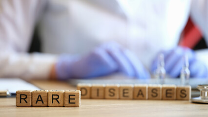 Rare disease words collected with wooden cubes - obrazy, fototapety, plakaty