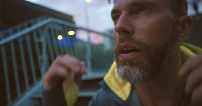 Motivated, ambitious and sweating athlete pushing himself harder during fitness, a difficult run or workout in the morning. Closeup of a man challenging himself to achieve health goals while training