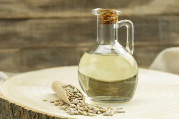 Bottle with fragrant sunflower oil and background with space for text