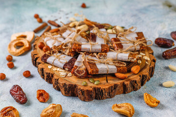 Variety of cereal or granola bars with dried fruits,nuts and seeds.