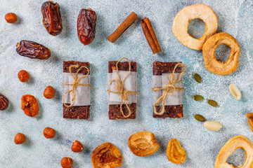 Variety of cereal or granola bars with dried fruits,nuts and seeds.