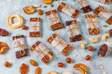 Variety of cereal or granola bars with dried fruits,nuts and seeds.