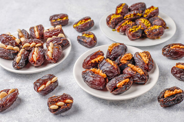 Fresh organic and various sweet dried date fruits.