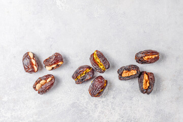 Fresh organic and various sweet dried date fruits.