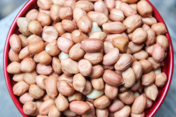 bunch of peeled peanuts or beans in a bowl best for agricultural and food bacground.