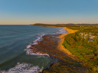 Aerial sunrise seascape with  clear skies