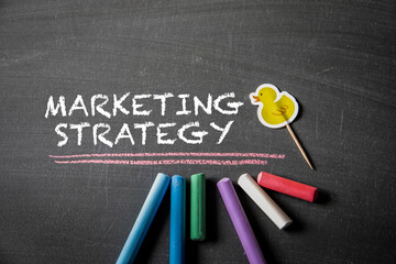 Fototapeta na wymiar Marketing Strategy. Text on black chalk board