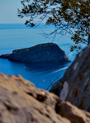 Beautiful view on the sea next to a huge mountain on the pretty island mallorca.