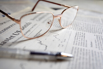 eyeglasses on the newspaper pages