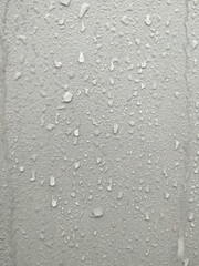 Raindrops on the gray wall