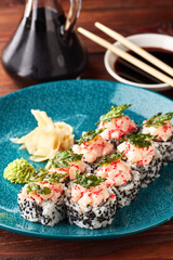 Sushi rolls with shrimps and parsley chips.