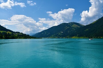 View Weissensee lake and Hochtratten mountain above in Carinthia, Austria