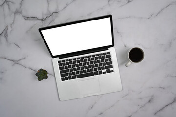 Overhead view laptop computer with blank screen, coffee cup and succulent plant on marble background