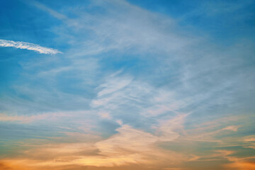 Yellow sunset sky, natural colors. Nature sky background. Twilight sky, Colorful sunset sky and clouds. Soft effect. Blue and orange gradient