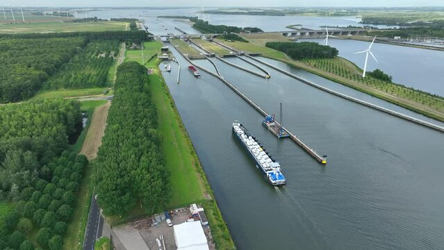 Vehicles Transported by Boat Entering the Volkerak Lock in the Netherlands