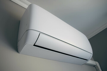 Split air conditioner on a white wall closeup